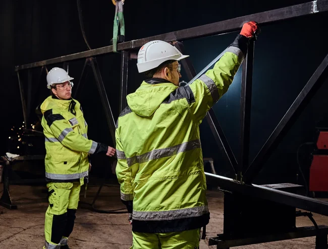 Oil field crew wearing FR-rated safety workwear and hi-vis uniforms in Texas