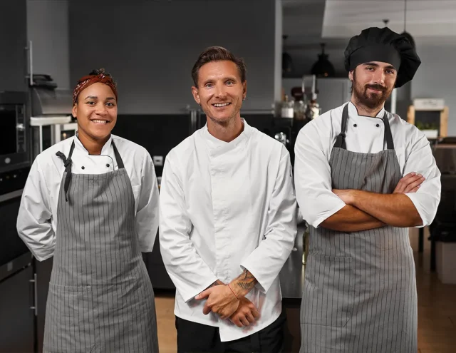 Restaurant staff wearing custom embroidered uniforms in Texas